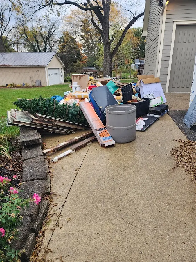 Dumpster being loaded with debris for Roofing Dumpster Rental in Homedale